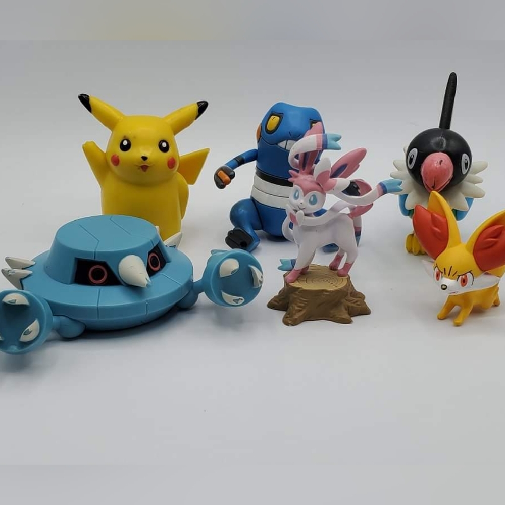 Pokemon characters Pikachu, Sylveon, Croagut, Chatot, Fennekin and Metang.